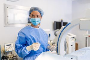 Female surgeon with surgical mask at operating room