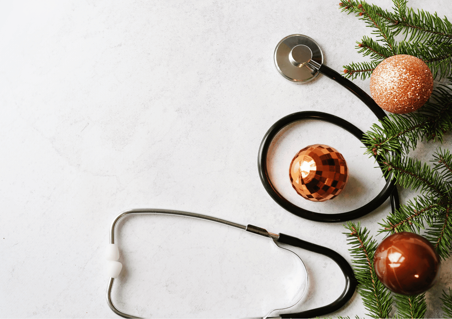 Stethoscope and pine tree and gold ornaments on a white background Christmas for nurses decor